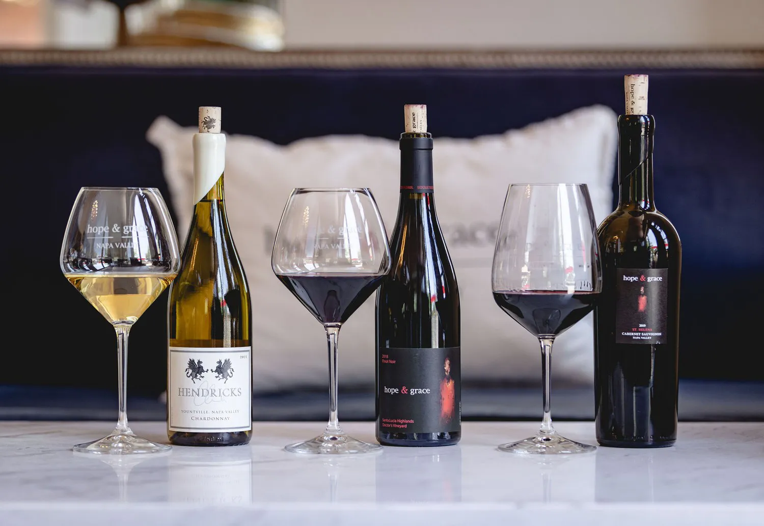Hope and Grace wine bottles and wine glass